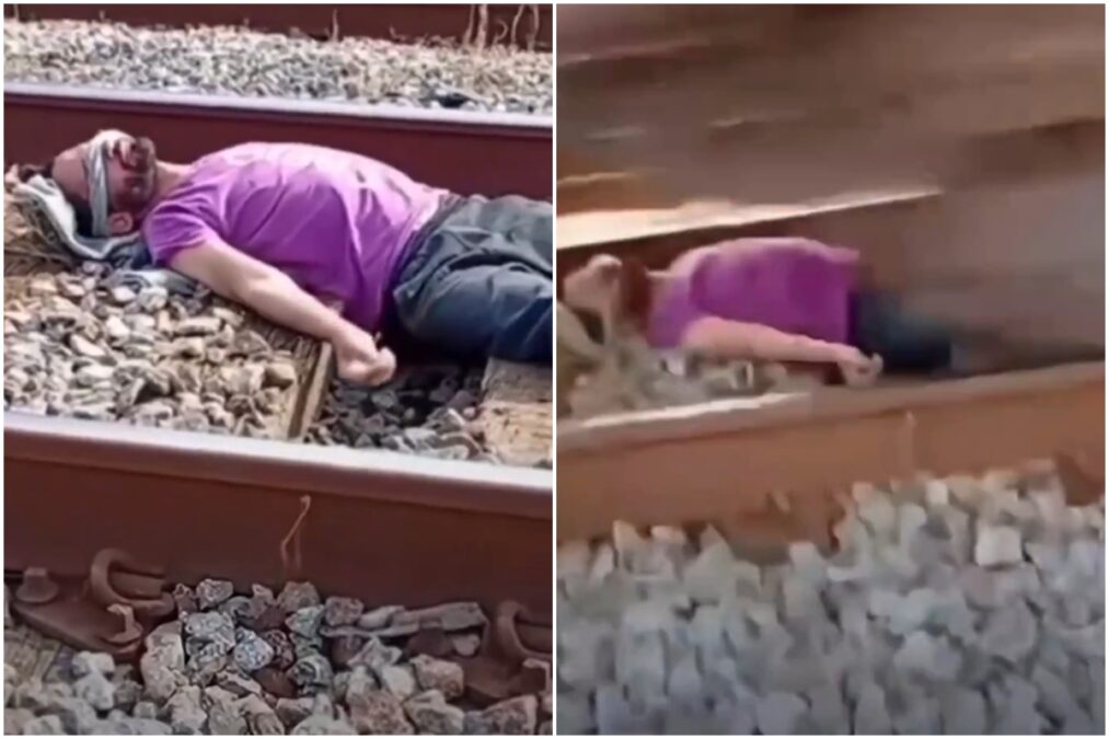 Homem deita em trilho e trem passa por cima dele em trend viral. Veja