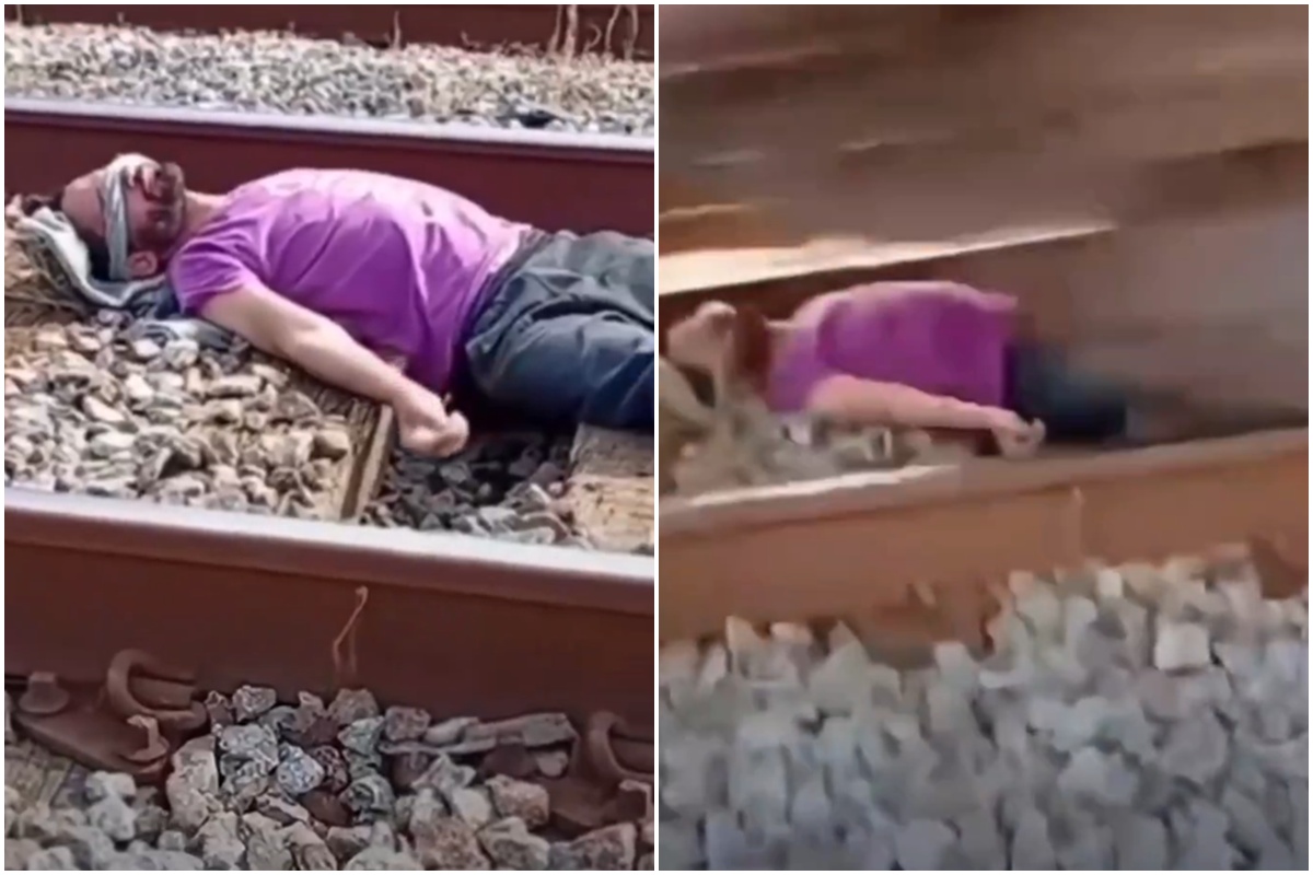Homem deita em trilho e trem passa por cima dele em trend viral. Veja
