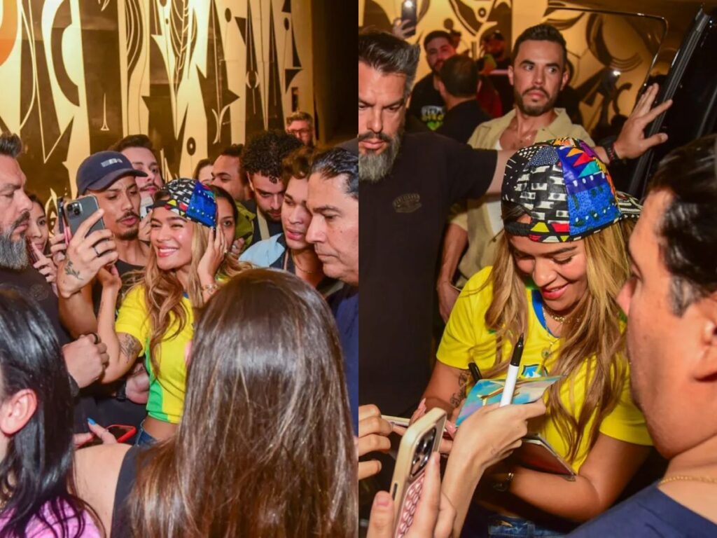 karol-g-atrai-multidao-e-esbanja-simpatia-ao-atender-fas-em-frente-a-hotel-em-sp