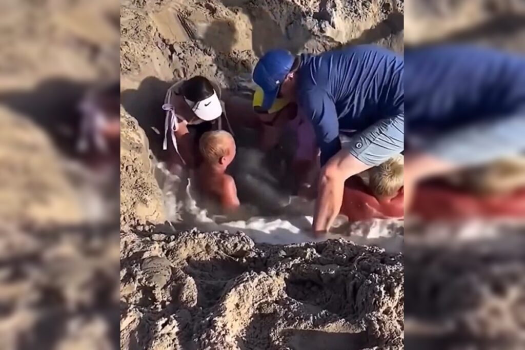criancas-ficam-presas-em-buraco-na-areia-da-praia-nos-eua.-video