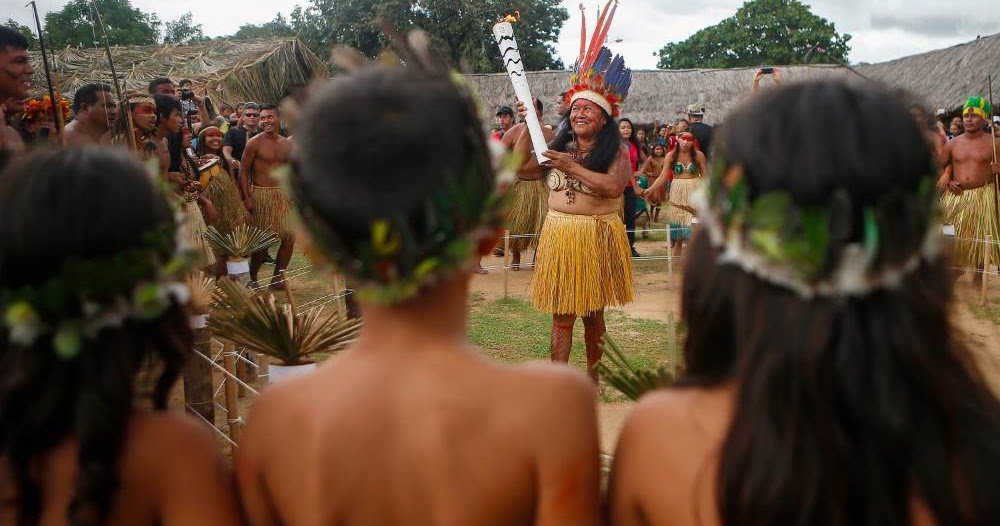 Comunidade indígena em área rural de Roraima de terra tradicional com presença de moradores e ambiente natural.